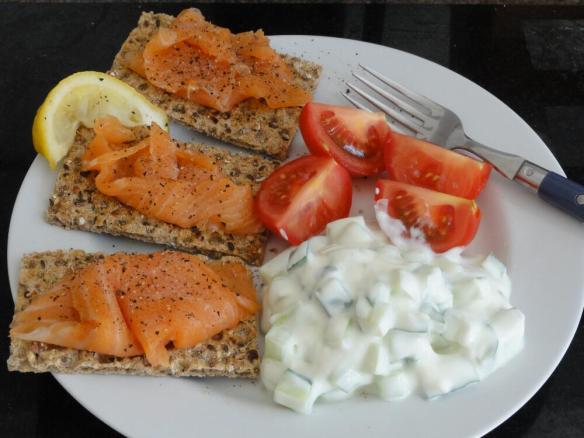 Ryvita and salmon with yougurt cucumber and tomato salad
